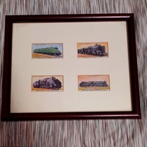 Framed vintage cigarette cards of European trains